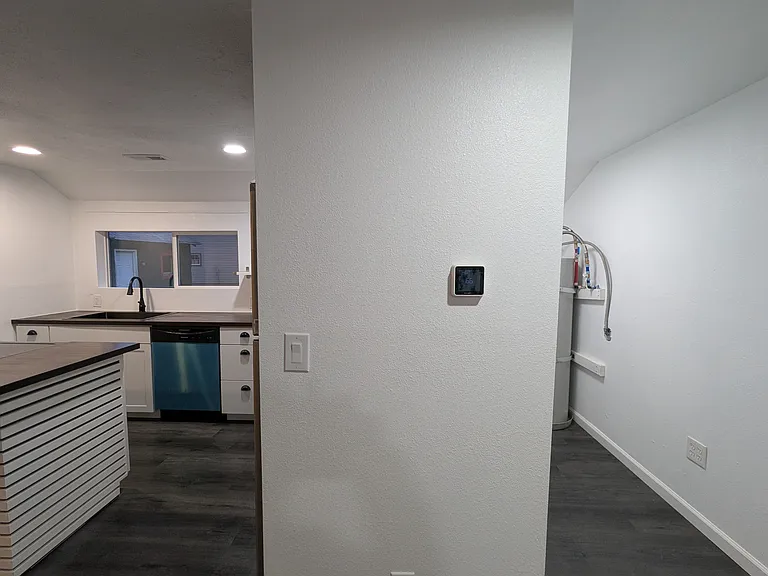 Laundry room right behind the kitchen.