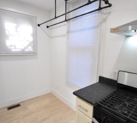 Kitchen with built in pot rack