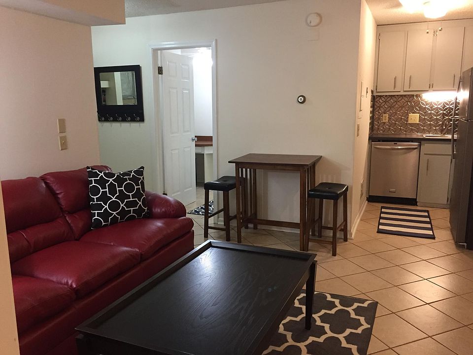 View of living/dining area and kitchen area as well as bedro