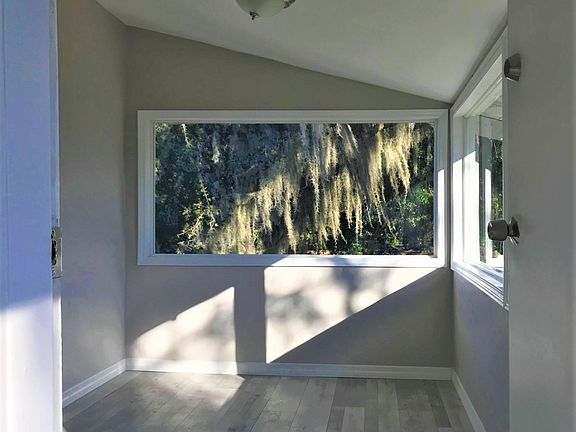 Balcony with many windows is bright and sunny!