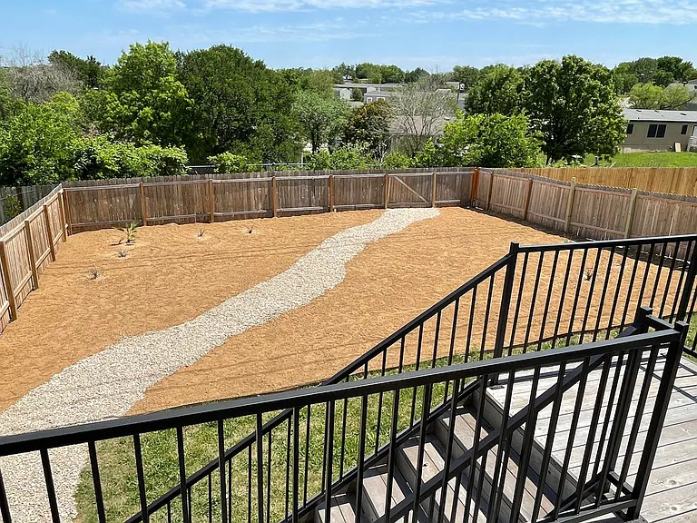 Xeriscape back yard area with one side perfect for a bonfire/sitting area and other a picnic table, ping pong table, or up to you.
