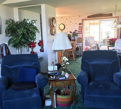 Living room has vaulted ceiling and is open to dining room.