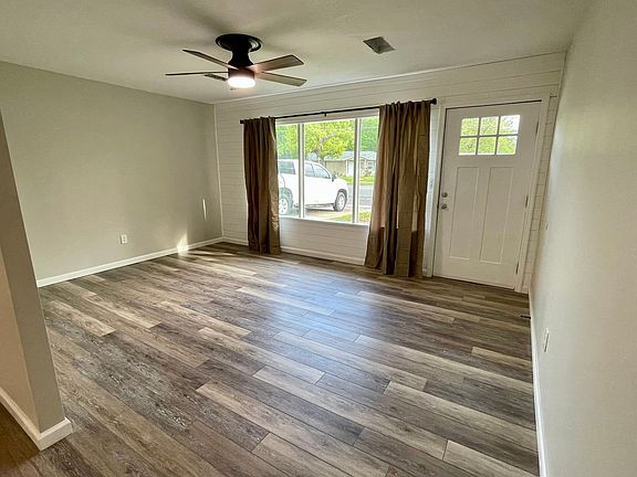 Living room with plenty of space and light. Shiplap accent wall