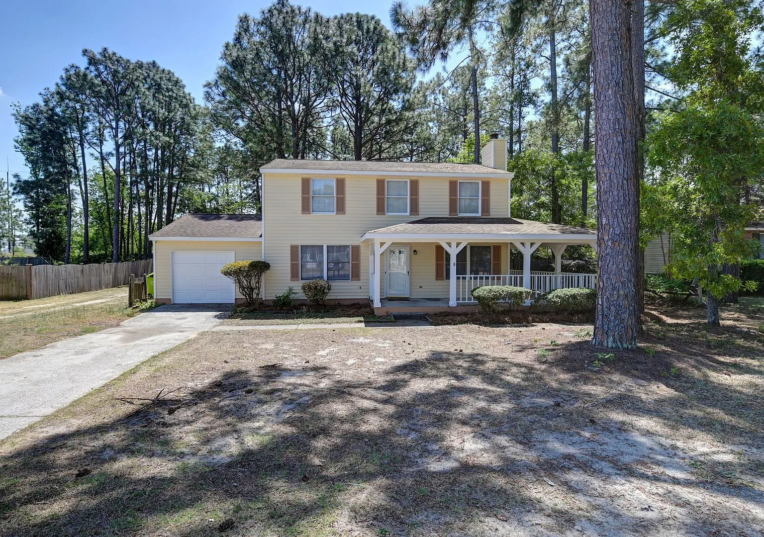 Spacious 3BR Home with Covered Front Porch & Expansive Backyard Near Dining & Shopping — Photo 1