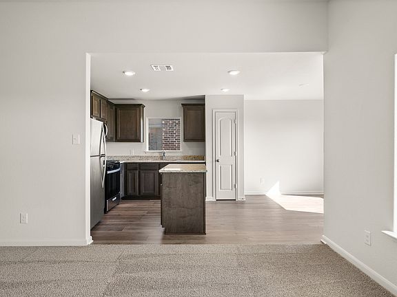 The dining room sits right off of the kitchen.
