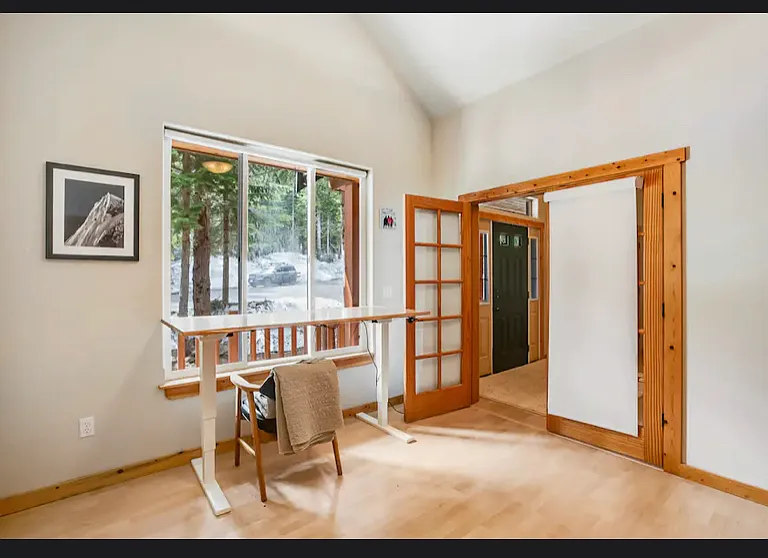 4th bedroom with king murphy bed and large vaulted ceilings