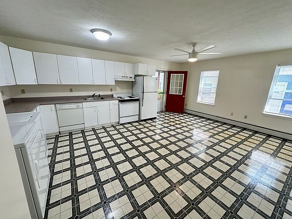 Large eat in kitchen with dishwasher and washer and dryer provided