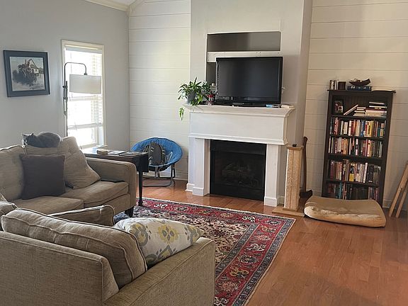 Living room with gas fireplace.