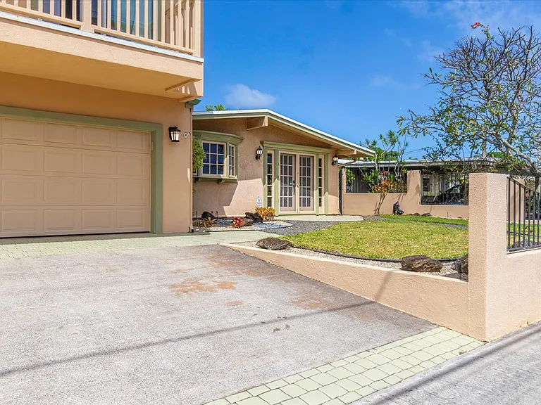 Private driveway and 2 car garage. (max car height 6ft. 1in.)