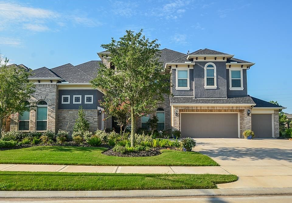 Immaculately maintained 5 bedroom home in the highly desired gated-community of Cinco Ranch Southwest. Over $100k in upgrades!