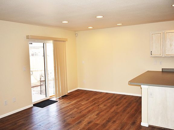Dinning area with additional seating at the kitchen counter.