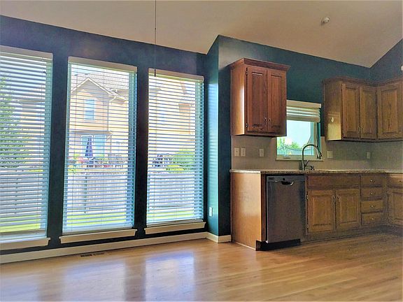 kitchen with breakfast area and hardwood floors