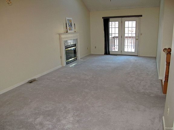 The Living Room has been freshly-painted and the newer carpeting just cleaned.