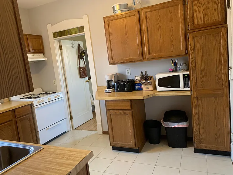 Kitchen - the door in back left opens up into bonus room/home office. Back of the Unit.