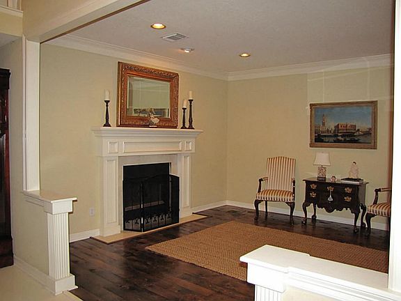 Versatile Formal Living Room with double sided fireplace could serve as a Study or would make a beau