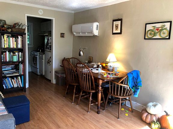 Main room furnished, kitchen behind