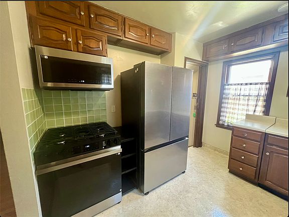 Kitchen- Stove, Microwave, and Refridgerator all bought in 2025 with new paint job in Kitchen.