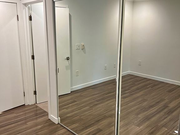 Large Mirrored Closets in Bedroom