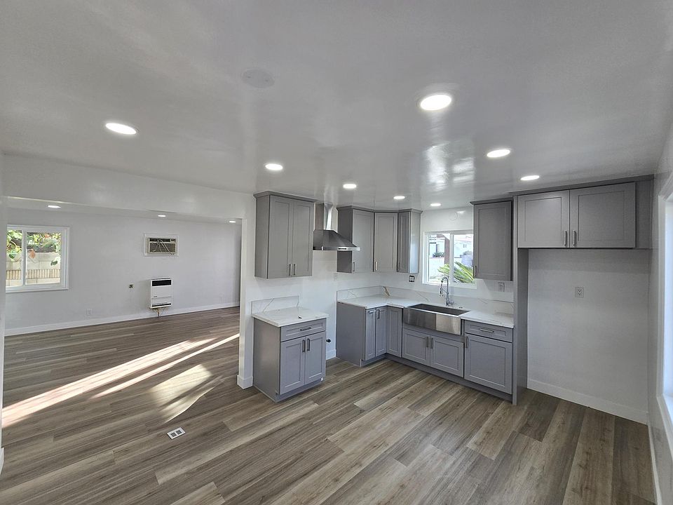 Large Kitchen/Dining with Open Concept Living Room-New cabinets, new Stainless Steel Farm House sink and Range Vent Hood