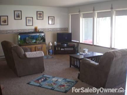Livingroom
						:
						5 large tall windows in the front of the home.