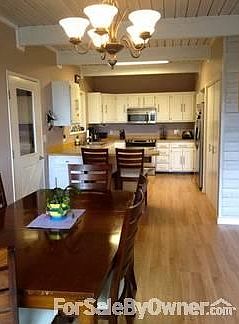 Dining and Kitchen
						:
						Open space with pergo & tile flooring, SS appliances, access to laundry/mudroom