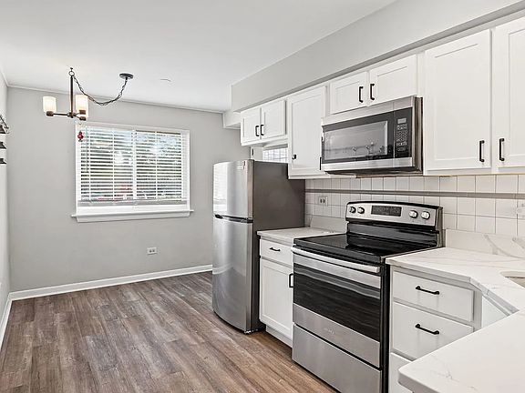 Kitchen with quartz countertops and stainless steel appliances
