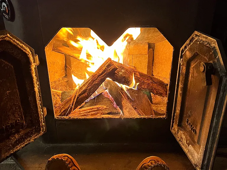 Morning Glow: Coffee, a crackling wood stove, and the calm of a new day.