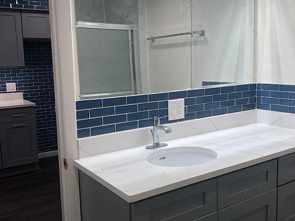 New vanity matching the kitchen, new countertop, new mirror and brand new gorgeous bright lighting