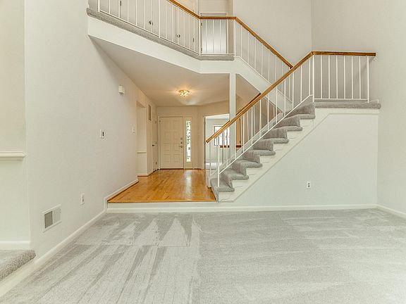 Living Room looking back into entry hall