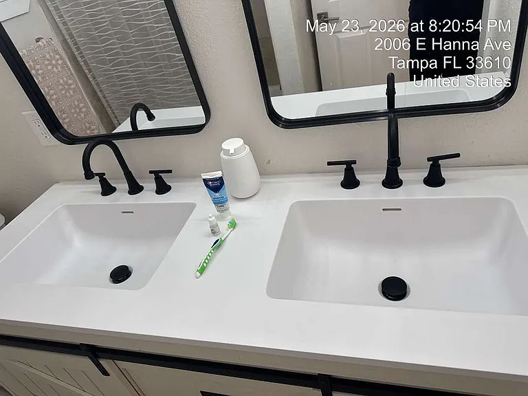 Sleek bathroom vanity with matte black fixtures and clean finishes.