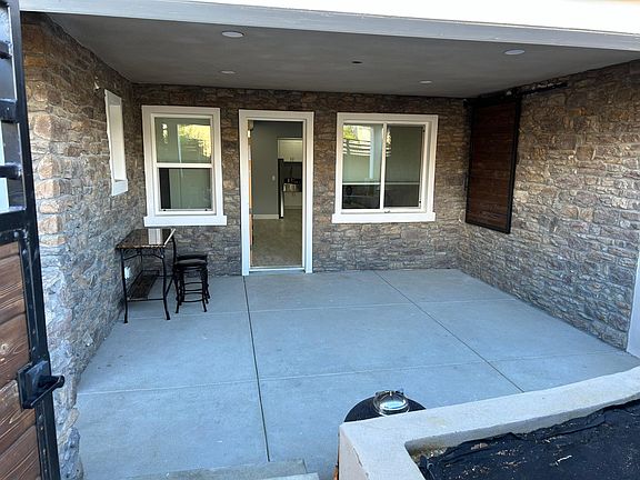 Patio showing BBQ area and private storage unit