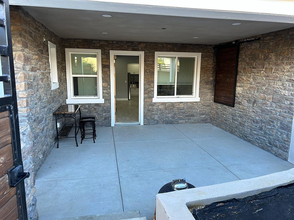 Patio showing BBQ area and private storage unit