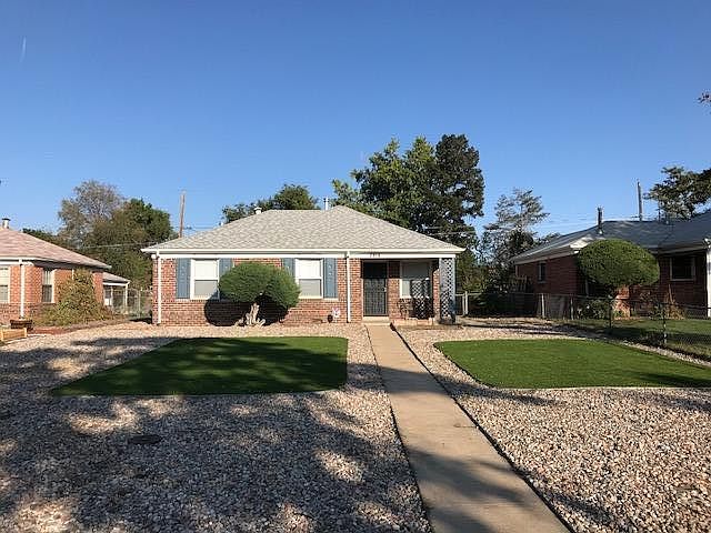 Beautiful single story brick home with low maintenance yard and turf.