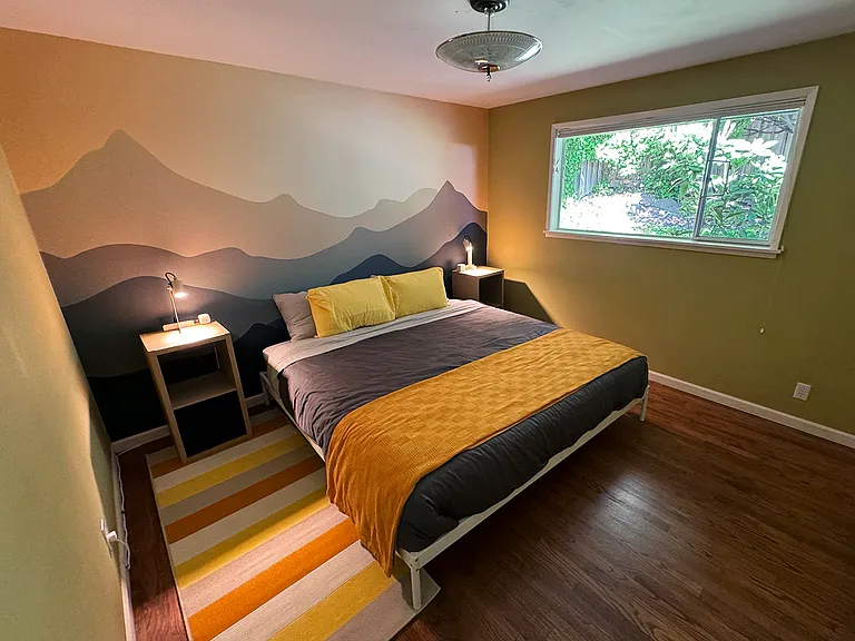 Bedroom 1 with a king size bed and a medium closet.