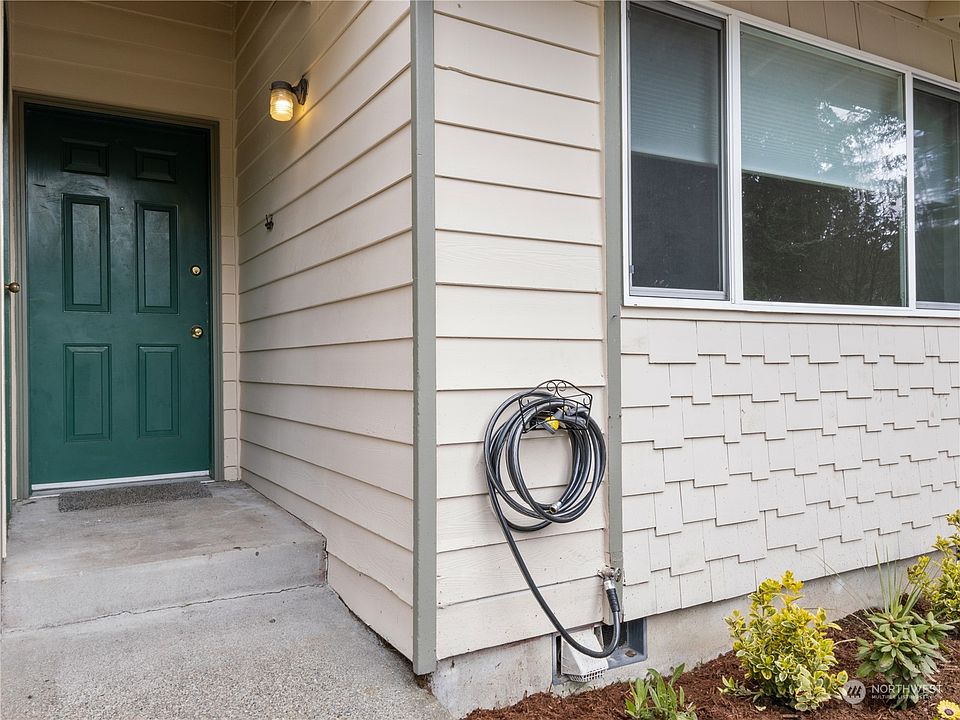Quaint entry with personal flowering garden to welcome you home.>