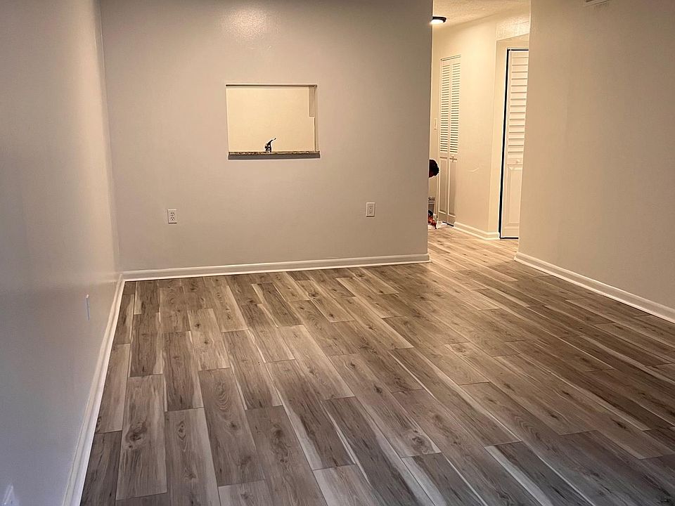 LIVING ROOM BACK VIEW WITH KITCHEN PASS-THRU WINDOW
