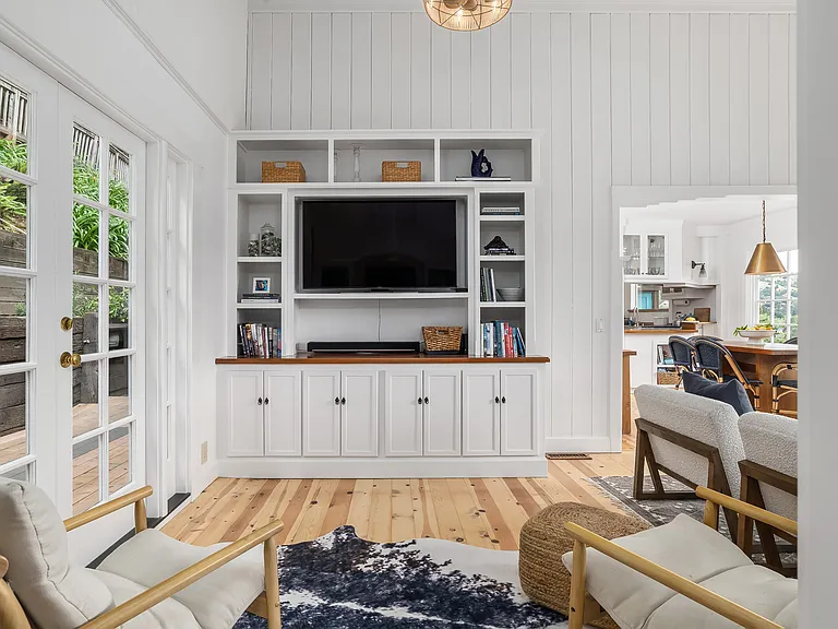 Entertainment room off of the great room with access to the back garden via the french doors.