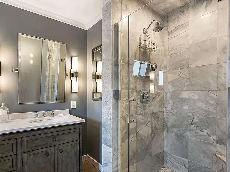 master bath shower (right side of photo) is stone and glass enclosure