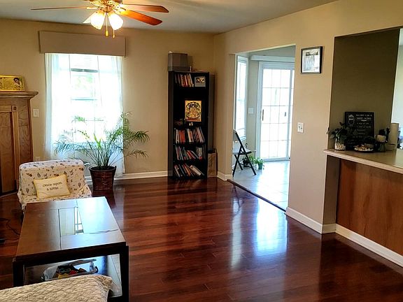Living Room with fireplace, pass through kitchen countertop adjacent to separate dining room