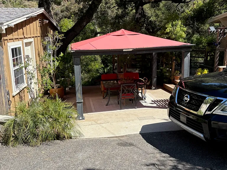 1st driveway. House gazebo, creek below