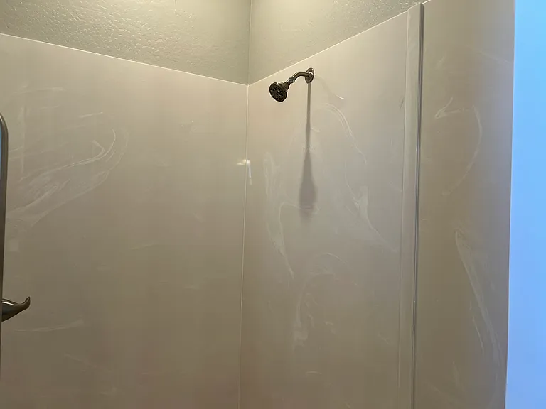 Hard Surfaced Shower Area has Seat