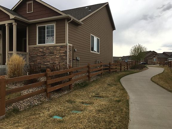 Walking path to side of home