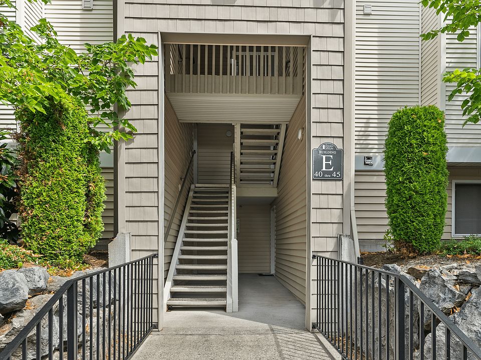Convenient stairwell access at Building E with well-maintained surroundings.