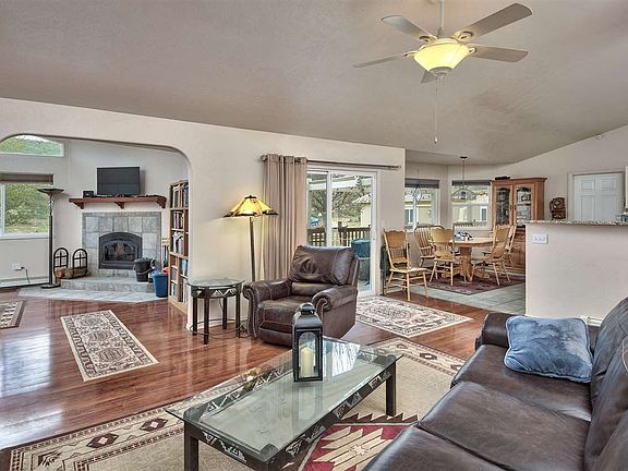 This custom-built home offers a living room open to the kitchen and the separate