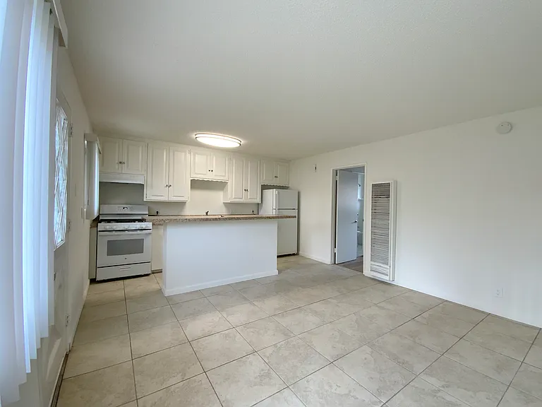 Living Area; Photos of a similar unit. Available unit has luxury vinyl "wood" plank flooring throughout except in the bedroom (high grade Berber carpet).