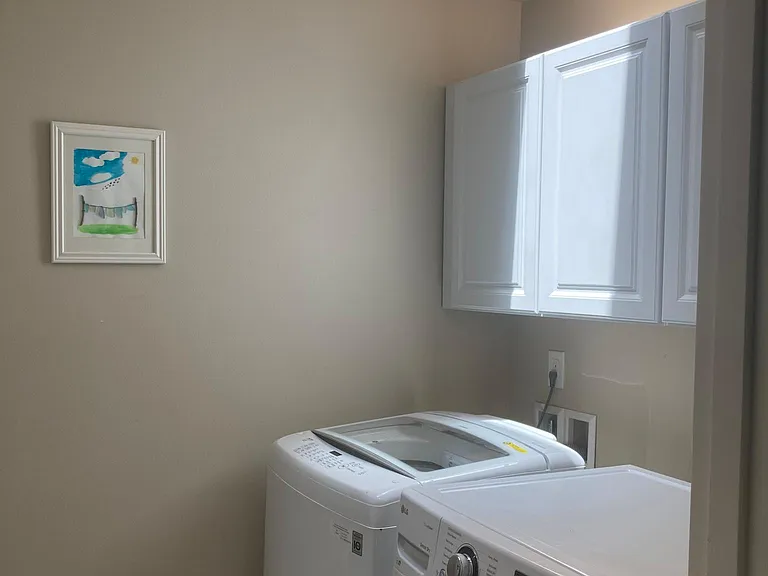 Upstairs: Laundry room with washer+dryer