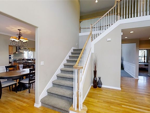 Open Entry with gleaming Hardwoods.