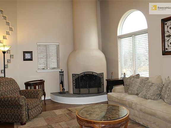 Featuring the wood burning adobe style fireplace and don't miss the glass block feature between the living and entry.