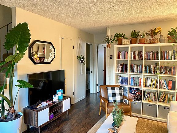 View of the living room. First door on the left is the coat closet, the second is the half bath, and the third is the kitchen