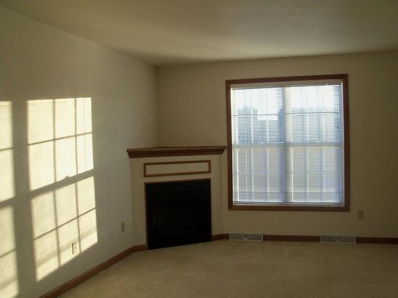 Living room area with corner fireplace